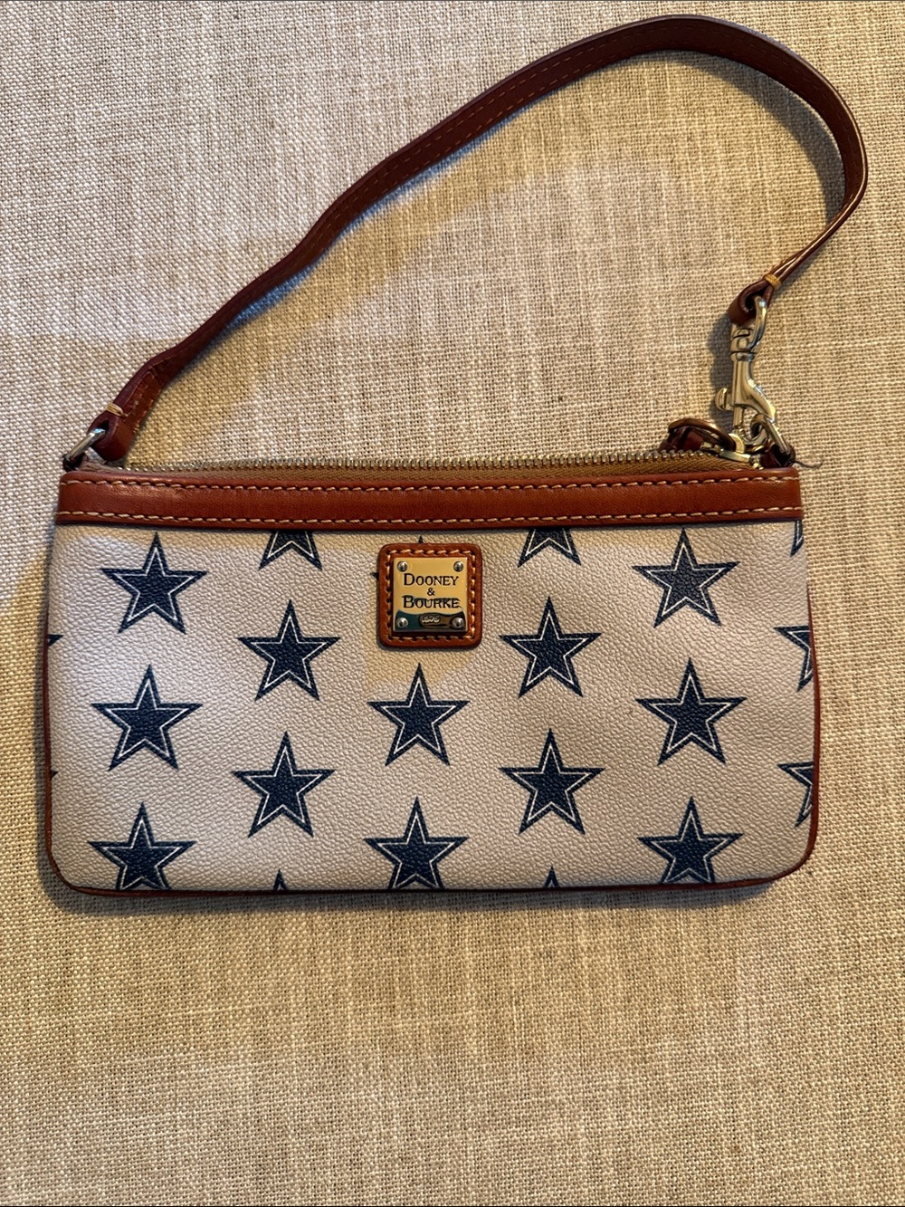 Dooney & Bourke Cream Wristlet with Navy Star Print and Brown Trim